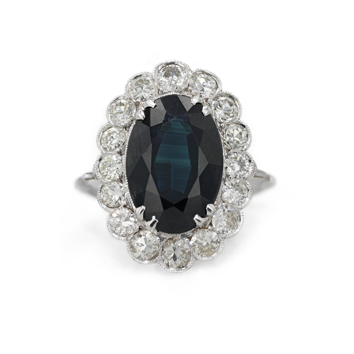 Bague saphir entourage diamants serti feston