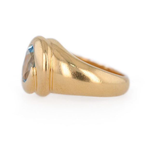 Bague jonc topaze bleue en or jaune 18 carats