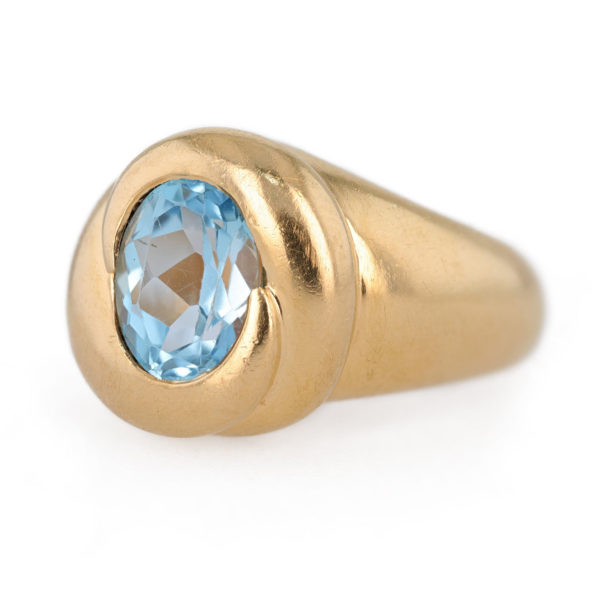 Bague jonc topaze bleue en or jaune 18 carats