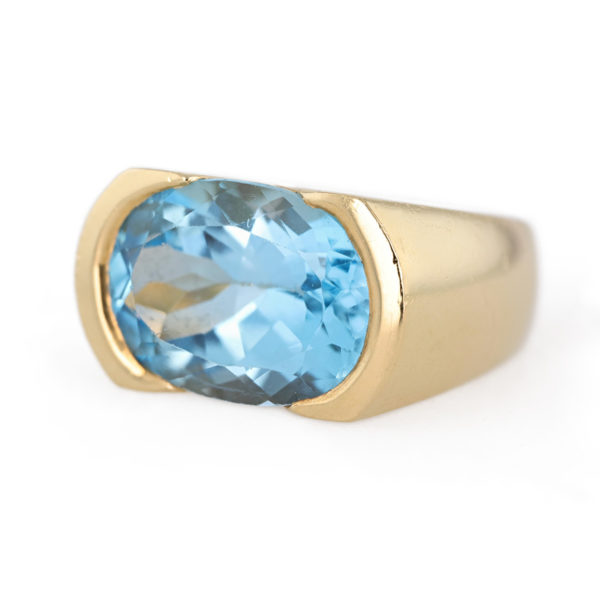Bague jonc topaze bleue en or jaune 18 carats
